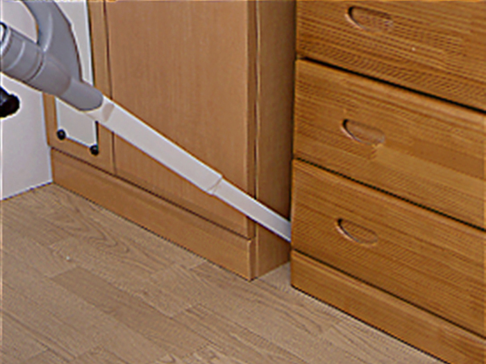 掃除機ノズルで吸い取る