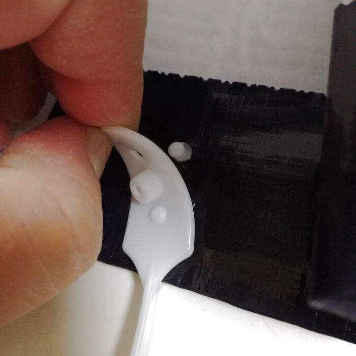 紙袋からハッピータックをとりはずします