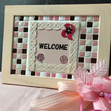 100均フォトフレームがタイルのウェルカムボードに