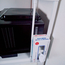 突っ張り棒でティッシュ箱の隙間収納