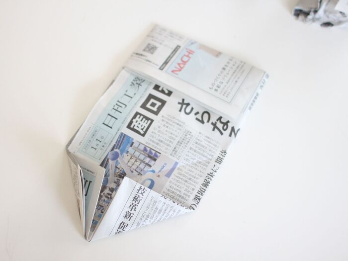 底になる部分を三角におります