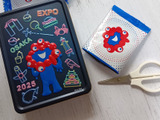 お菓子缶とお菓子の袋、無印良品で万博各国の入館パビリオンスタンプ手帳を手作り！保存箱にも
