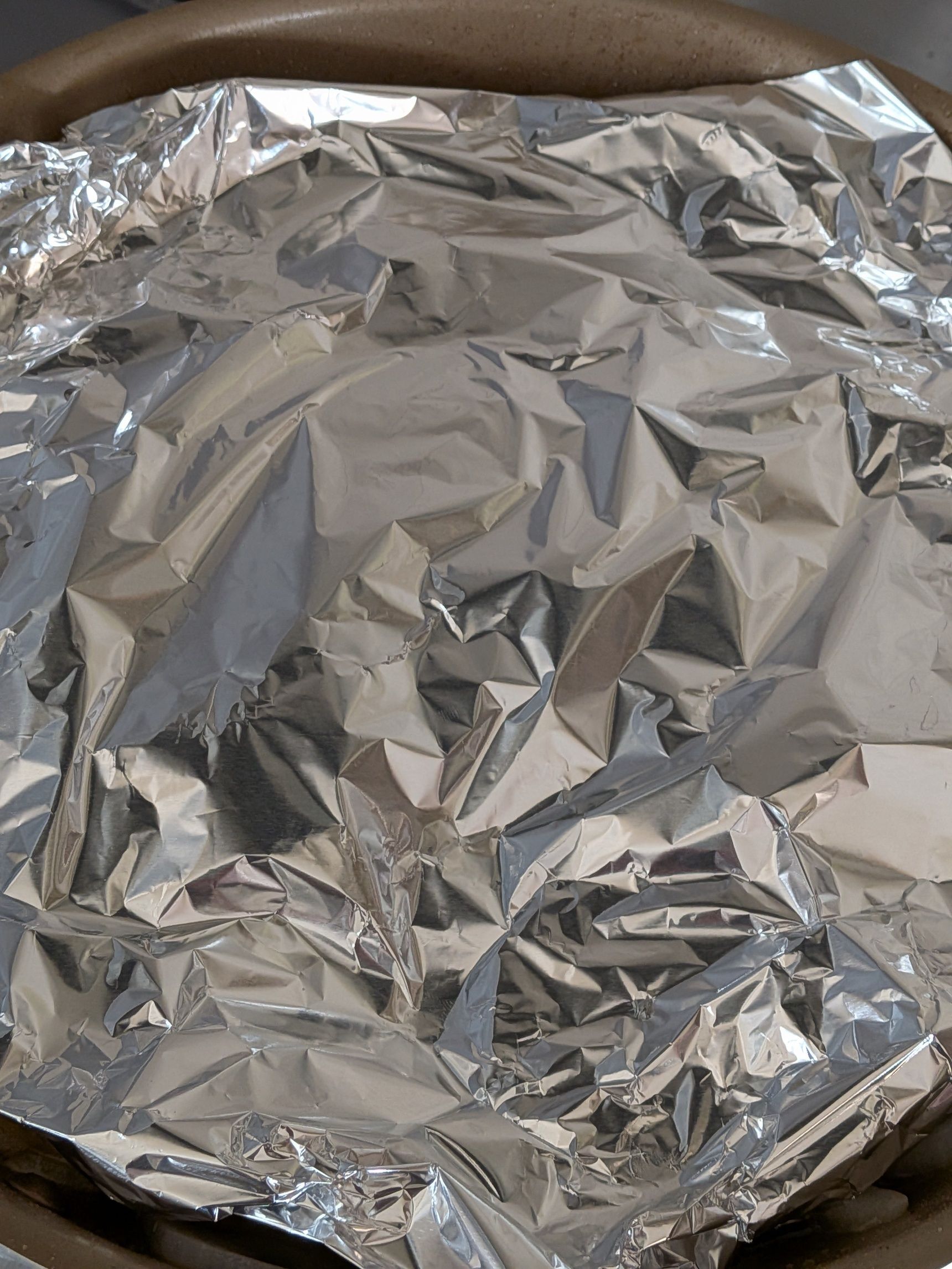 3. ◯を入れアルミホイルで落し蓋をする。弱火〜中火で火にかけ、8分加熱する。